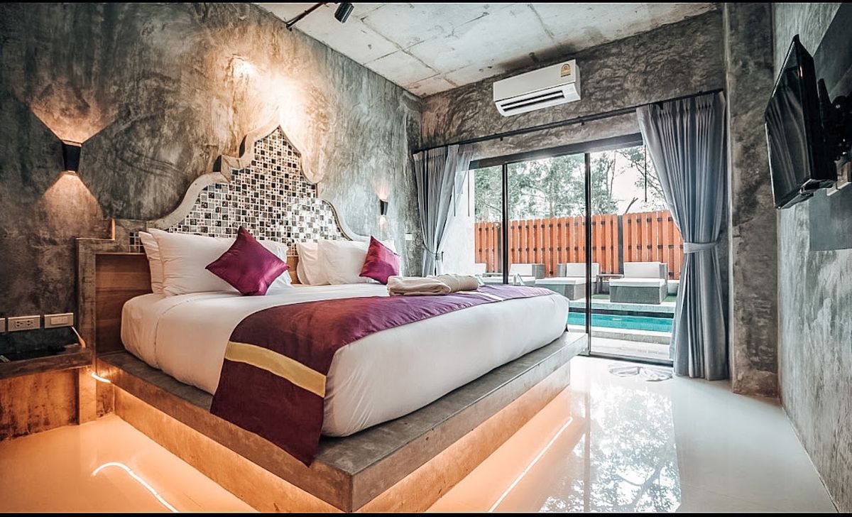 Maneetel Krabi Beachfront pool and grounds in Ao Nang